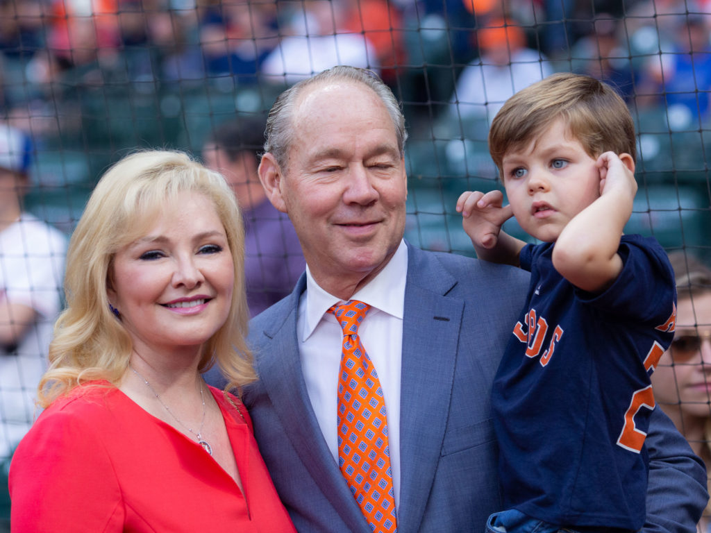 Houston Astros owner Jim Crane, his wife Whitney and his son James Robert Crane II embrace the Minute Maid Park fun. (Photo by F. Carter Smith)