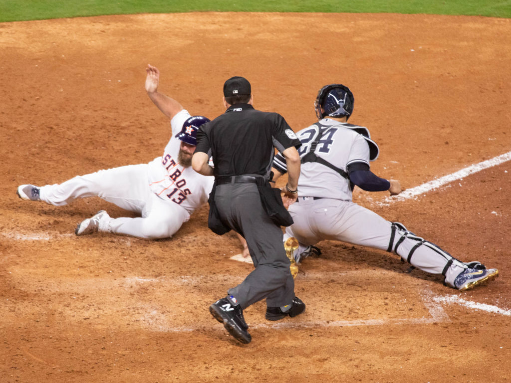 Tyler White made sure he scored from first to tie the game at 3 in the seventh, just beating the tag. (Photo by F. Carter Smith)