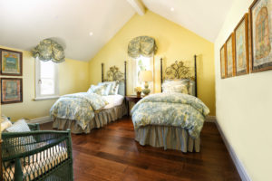 The yellow bedroom at the Corona del Mar home designed by Bill Stubbs for a couple from San Antonio.Bedroom Yellow Horizontal 436