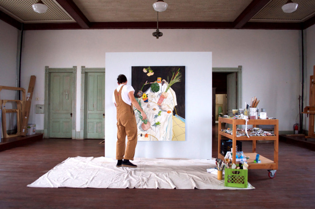 Bradley Kerl painting in the third-floor studio at 100W, Corsicana, Texas (Photo by Kyle Hobratschk)