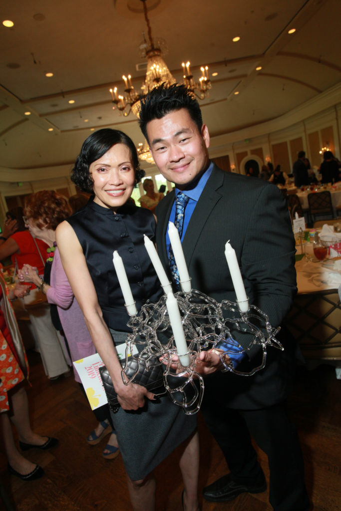 Duyen Nguyen, Andrew Hsueh, with a borosilicate glass candelabra by Susan Plum (Photo by Katy Anderson)