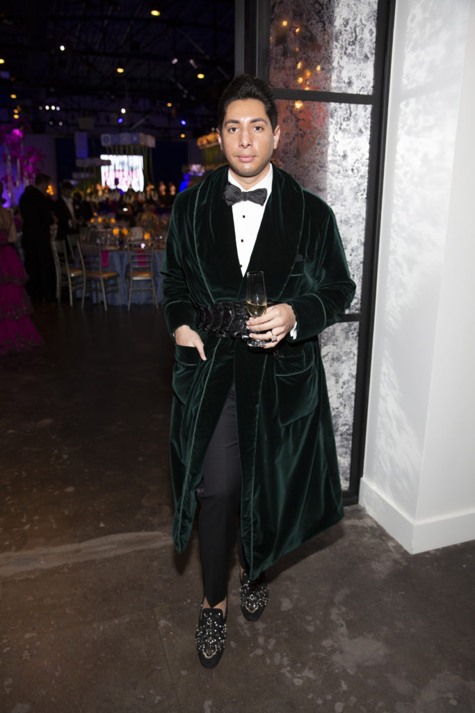 Christian Miranda wore a dark green Dolce & Gabbana velvet coat to the Houston Grand Opera Ball. (Photo by Jenny Antill)