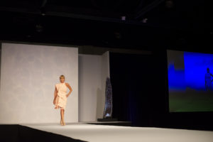 Community model Bobbi Jo Miller in the spotlight at the Giving Goes Glam fundraiser. (Photo by Jen McDonald for Interfaith of The Woodlands)