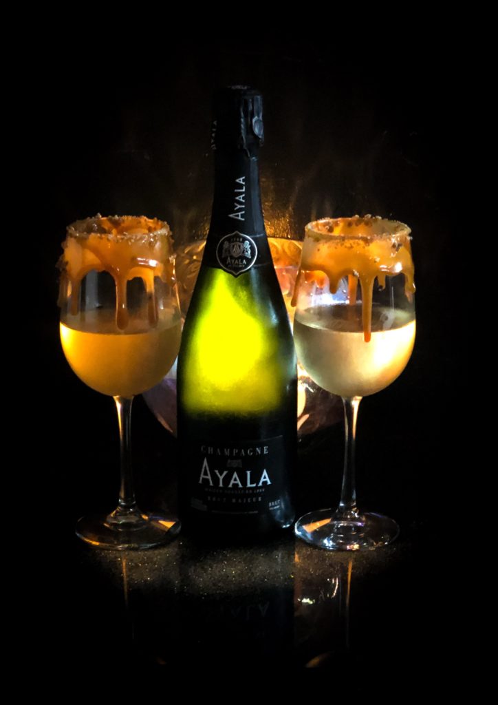 The French Kiss drink is Champagne covered in caramel and bruleed sugar.