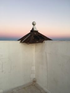 The author snaps a sunset from the rooftop at 100 West during happy hour. (Photo by Bradley Kerl)