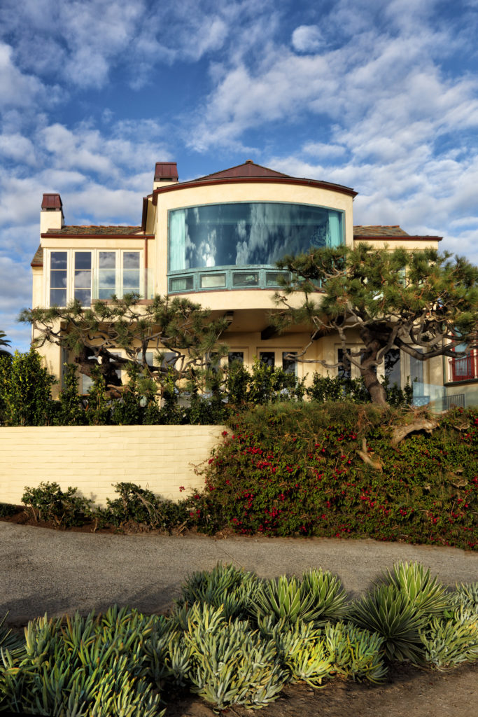 The grand picture window at the Corona del Mar home designed by Bill Stubbs for a couple from San Antonio looks out on to the Pacific.