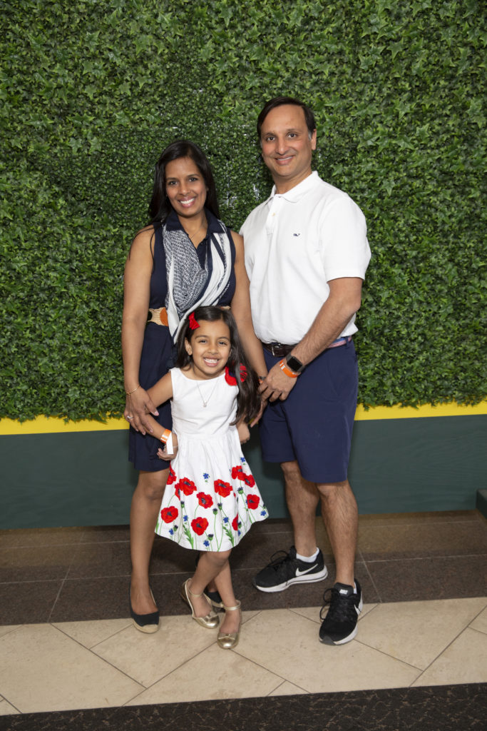 Kusum & Cody Patel with daughter Krishna at Minute Maid Park during the Texas Children's Hospital Family Fun Day. (Photo by Chin Phan)