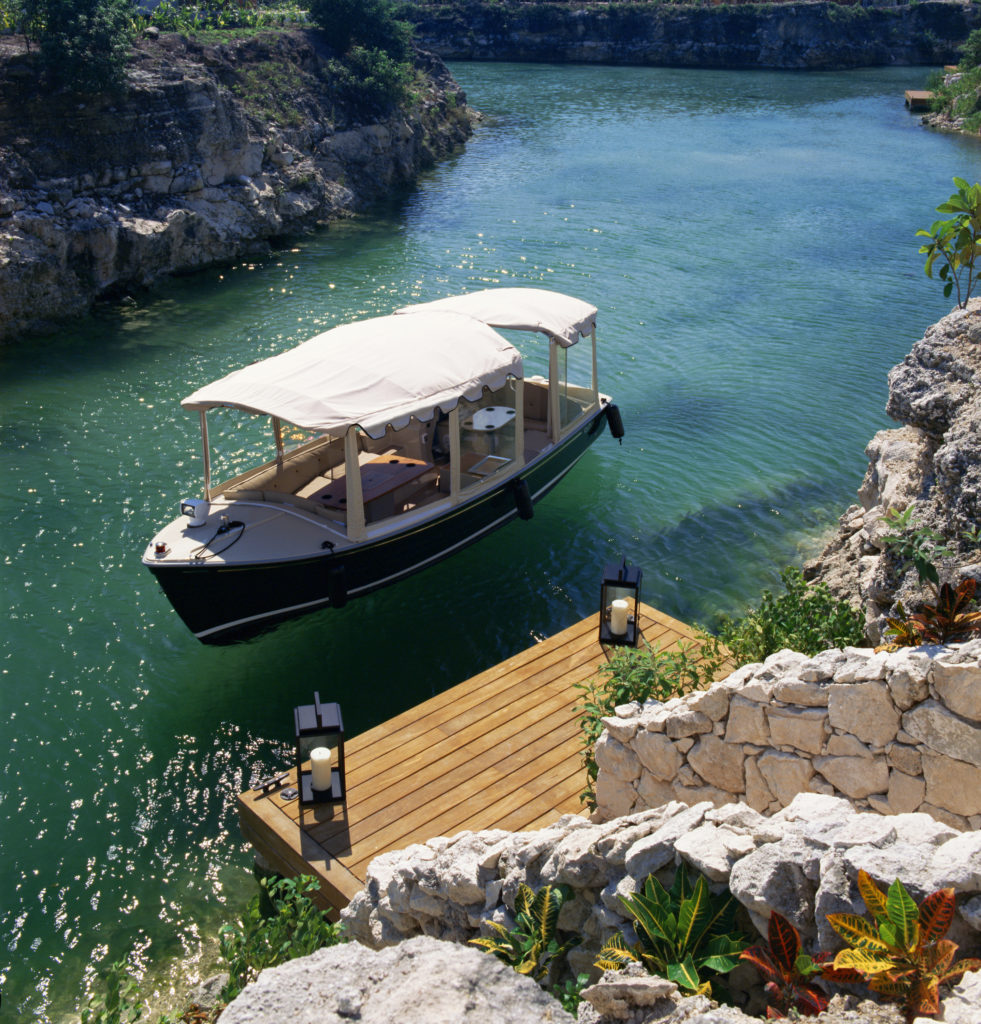 The perfectly polished, classic duffy boats escort guests to each resort through the freshwater canals of Mayakoba. (Photo Courtesy of Mayakoba) 