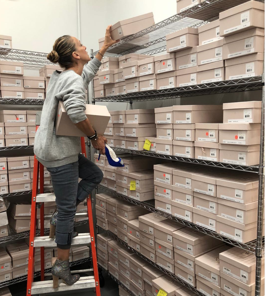 Sarah Jessica Parker in the storeroom of her SJP boutique in New York, piling up shoes for her Houston sample sale. (Instagram photo)