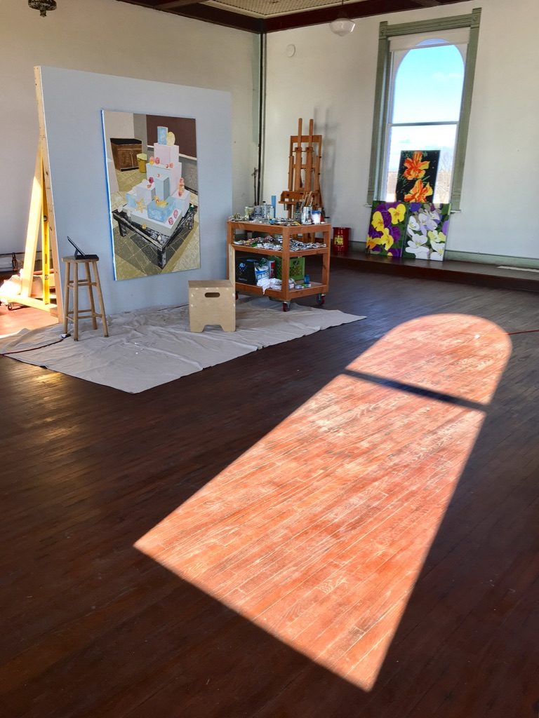 Kerl's canvases line the walls of 100 West. (Photo by Bradley Kerl)
