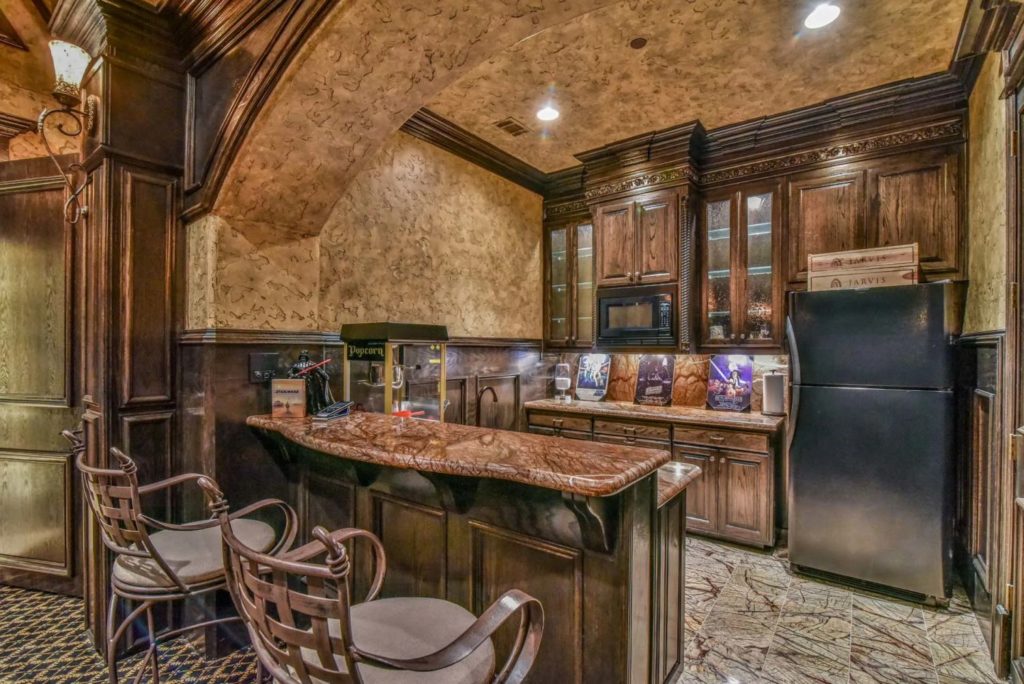 The wet bar is what we'd call extravagant. (Photo by Concierge Auctions)