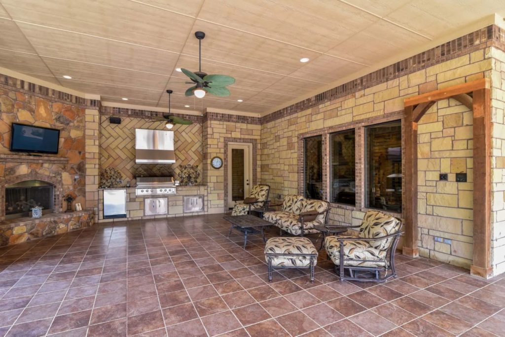 The outdoor living room is just as ghastly as the interior.  (Photo by Concierge Auctions)