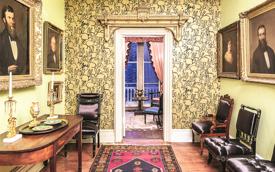 A wall in the historic Cordts Mansion, in Kingston, New York — one of Hunt Slonem’s multiple residences — features his yellow Hutch wallpaper for Groundworks. The artist is known for his preservation commitment and dramatic decorating schemes interjecting pattern and color into the past. 