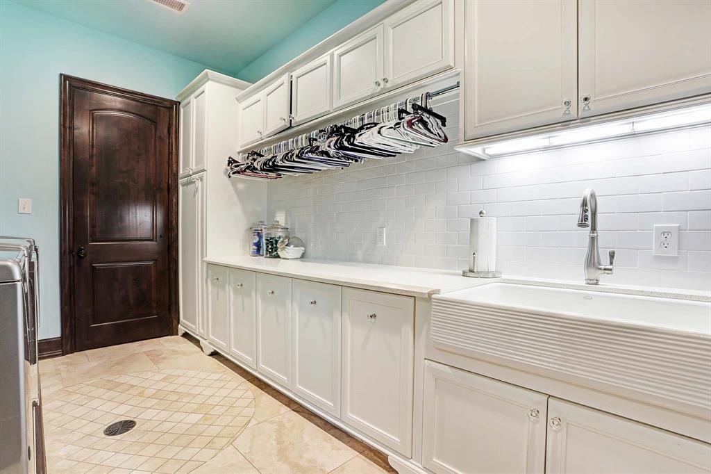 The laundry room is massive — and it needs to be, with that much closet space. (Photo by HAR)