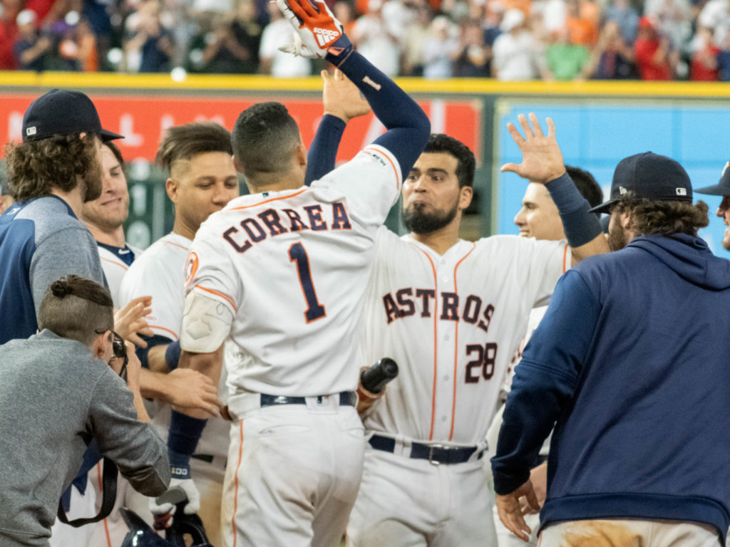 Carlos Correa and the Astros know how to celebrate. (Photo by F. Carter Smith)