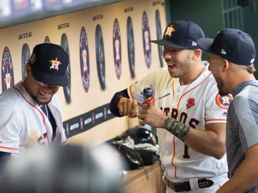 The resting Carlos Correa and injured George Springer still had some fun in the dugout. (Photo by F. Carter Smith)