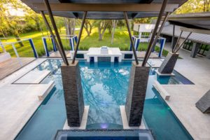 Contemporary architecture with a hint of the brutalist movement calls for a unique pool design such as this one at 3 W. Rivercrest, listed with Susan Boss of Martha Turner Sotheby’s International Realty.