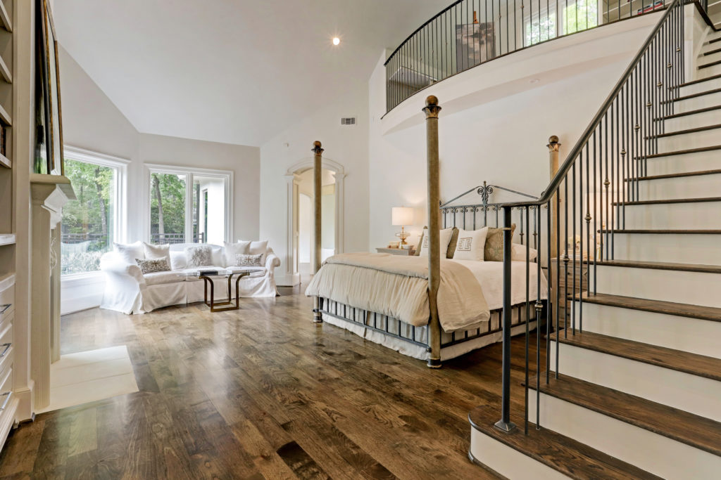 The master bedroom at 12014 Tall Oaks is indeed a masterpiece with its balcony study, as seen at the John Daugherty Realtors Spring Soirée open house. (Photo by TK Images)