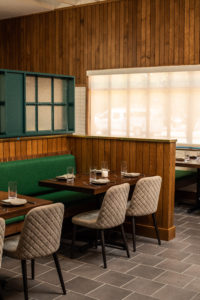 Wood-paneled walls add warmth to the space (Photo by Reed Kenney)