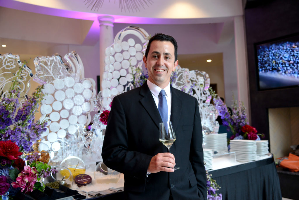 Theorem Wine's vice president of operations and sommelier James Cerda at the Kisha & Jason Itkin party. (Photo by Al Torres Photography)