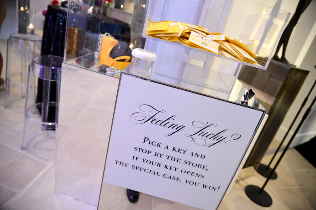 de Boulle offers guests a chance to win a piece of jewelry at the Theorem Wine release party. (Photo by Al Torres Photography)