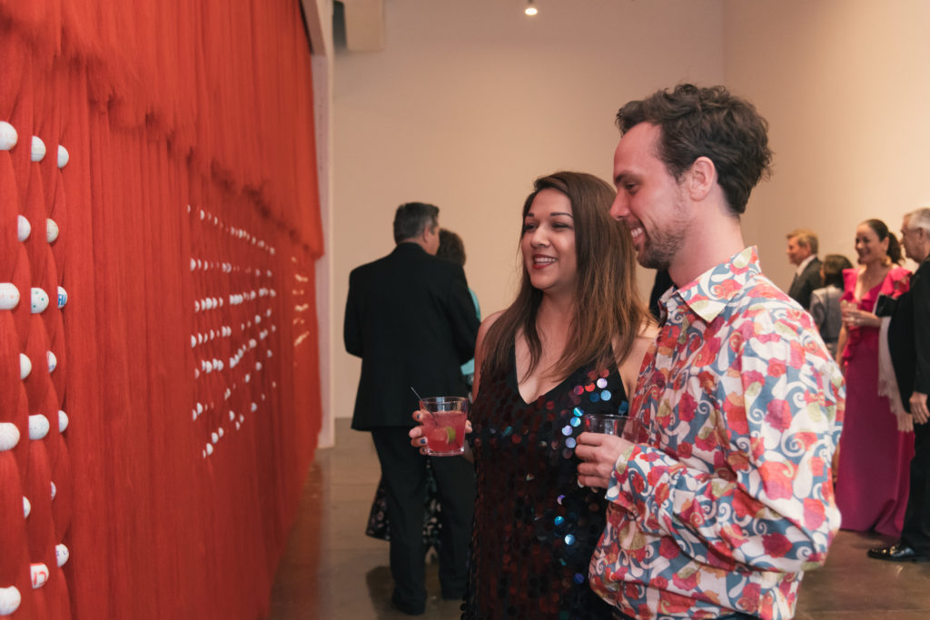 Ashley Mireles, Michael Stoltz take in Artpace resident Jennifer Ling Datchuk's installation at Artpace's The Happening: Diskoteka Nite. (Photo by Beth Devillier)