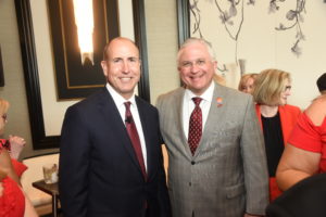 Doug Lawson, Randy Walker at the American Heart Association Go Red for Women luncheon.