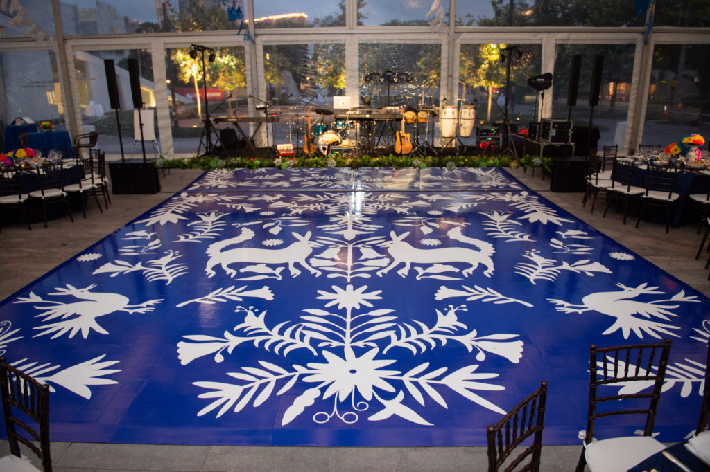 The papel picado-inspired dance floor follows the color theme of the Glassell School of art benefit. (Photo by Wilson Parish)