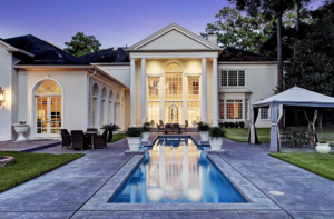 An outdoor pool is just the start of the water play at this 14,000 square foot French Colonial home in Rivercrest, listed with John Daugherty Realtors.