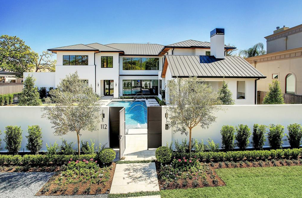 The swimming pool serves as a welcoming water feature at 112 Glenwood new construction home from Allan Edwards.