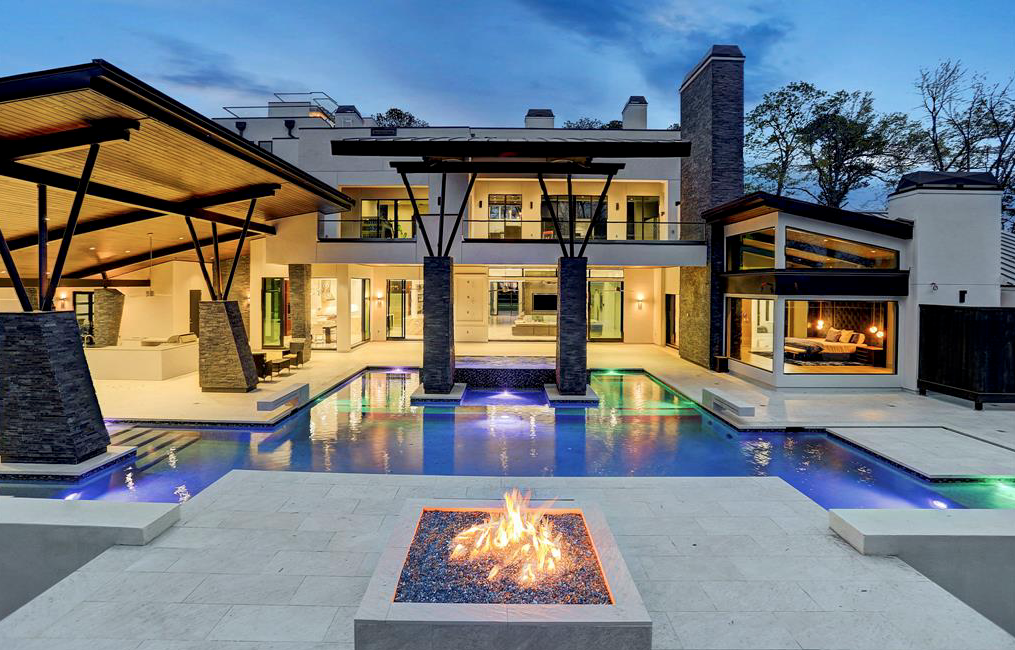 Every modern-day pool feature calls for a fire pit to complete the picture as here at 3 W. Rivercrest.,  designed and built by Frankel Building Group.