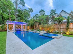 Figurehead side fountains provide movement in this pool picture at 11611 Windy Lane.