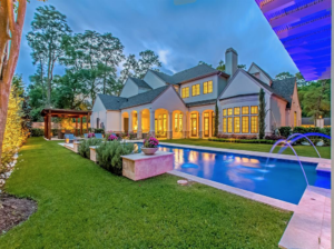 The pool at 11611 Windy Lane is a beauty that reflects the grandeur of the house.