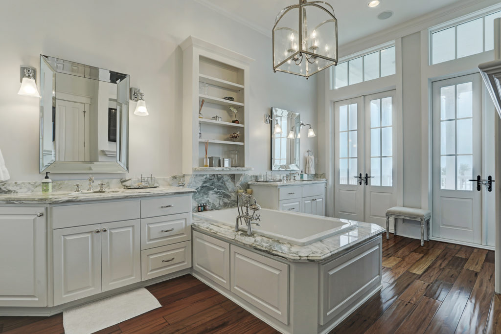 Matching sinks flank the open tub in the Beachtown residence. (Photo by TK Images)