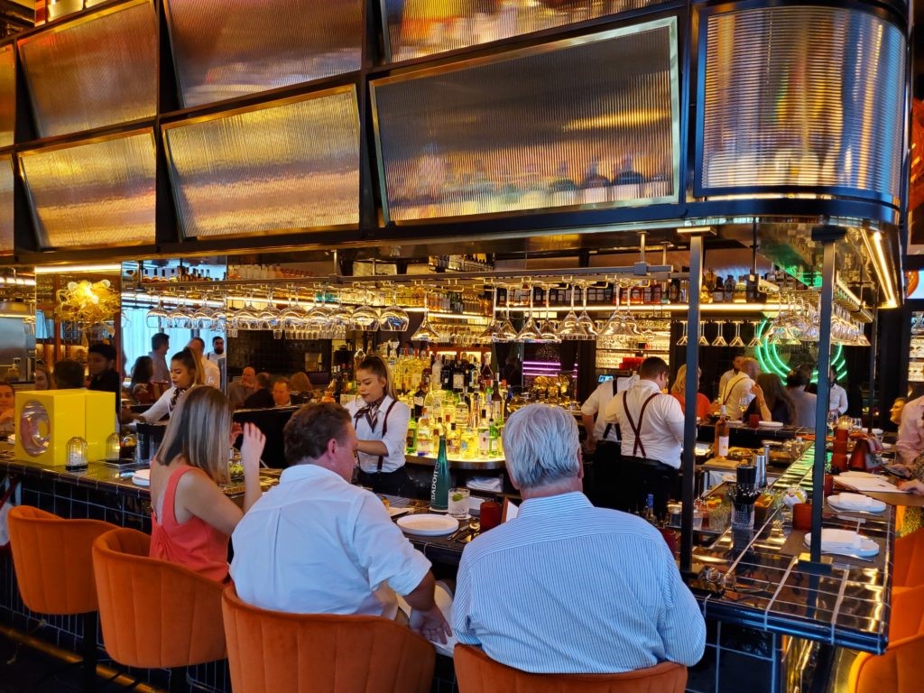 The wrap-around bar seating at MAD offers 360-degree service, no standing allowed.  (Photo by Shafik I. Rifaat)