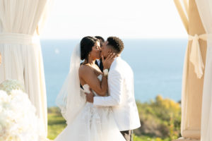 The couple's first kiss as husband and wife. (Photo by Duke Images)