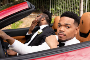 Groomsman Darius White and the groom arrive at the wedding in a Ferrari. (Photo by Duke Images)