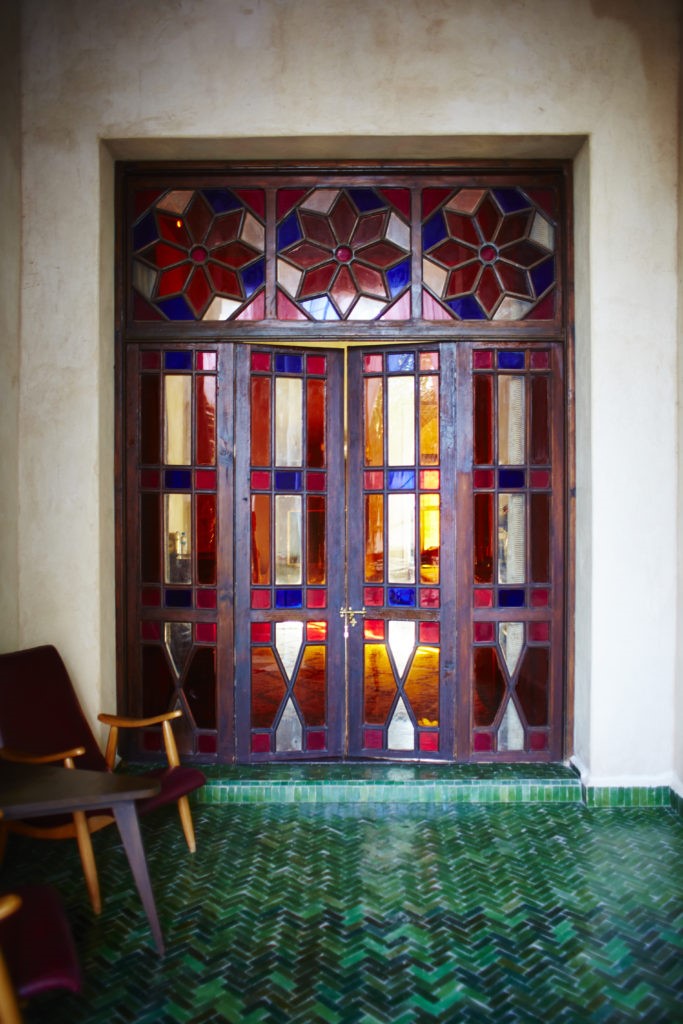Stained glass presents a colorful ploy to the green tile floor. (Photo by David Loftus)