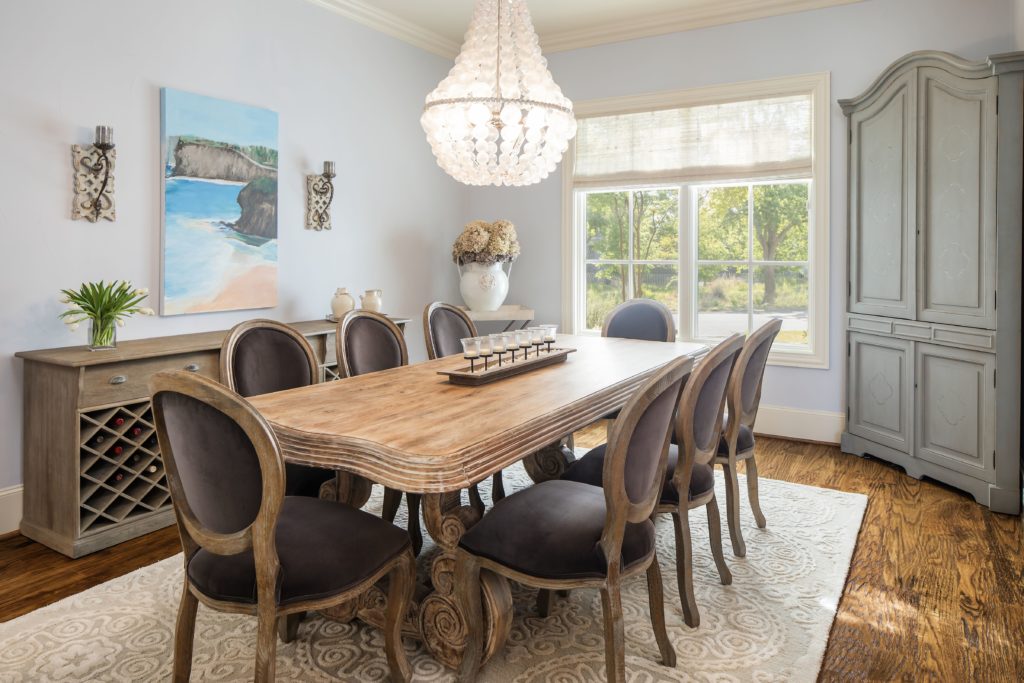 The dining room has views of the luscious backyard. 