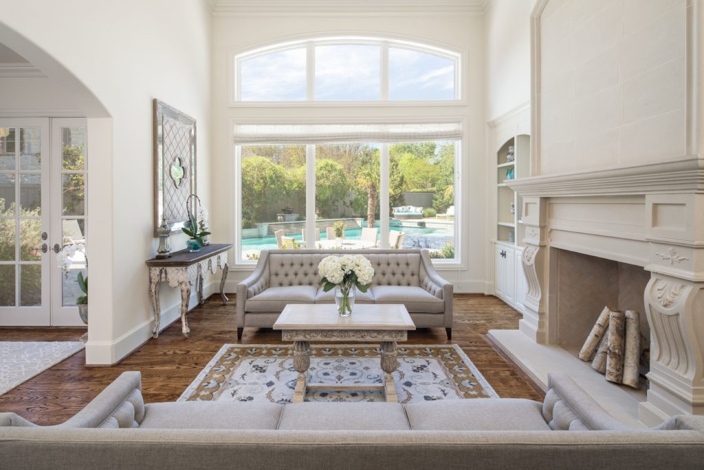 The living room features a magnificent fireplace. 