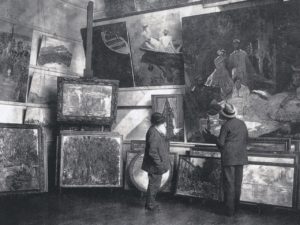 Claude Monet in his second studio in Giverny with the Duc de Trevise, 1920