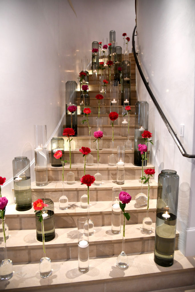 Stairways at the Itkin home were dressed in candles and peonies for the Theorem Wine Release Party. (Photo by Al Torres Photography)