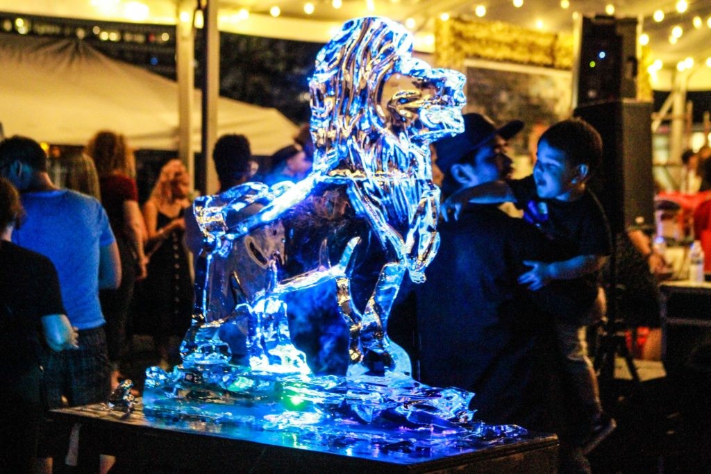 A regal big cat rendered in ice by Reverend Butter at the Fifth Anniversary of Mr. D's "Préservons la Création" mural in Midtown. (Photo by Chris P. Bachman)