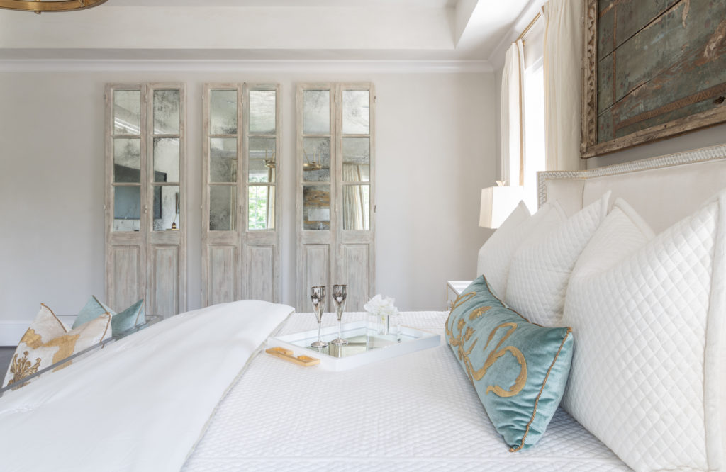 The master bedroom, by Teena Caldwell of Twenty Two Fifty Interiors, exudes French style with modern elements.  (Photo by Michael Hunter Photography)
