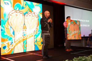 Artist Gonzo247 during the live auction with his survivor painting