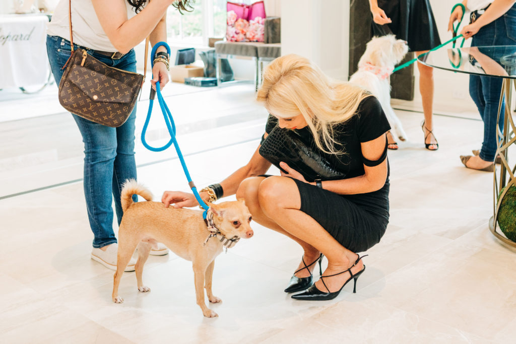Tena Lundquist Faust with an ADORE Houston pup at the Houston PetSet 'Fierce & Fabulous' fundraiser/open house. (Photo Bonner Rae Photography)