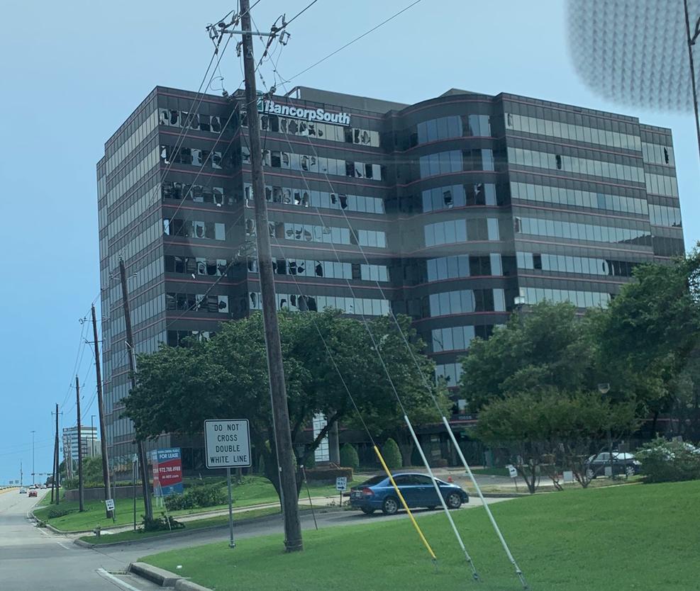 An office building off of I-75 and 635 had its windows blown out. Photo by McKay.Adrienne via NBC
