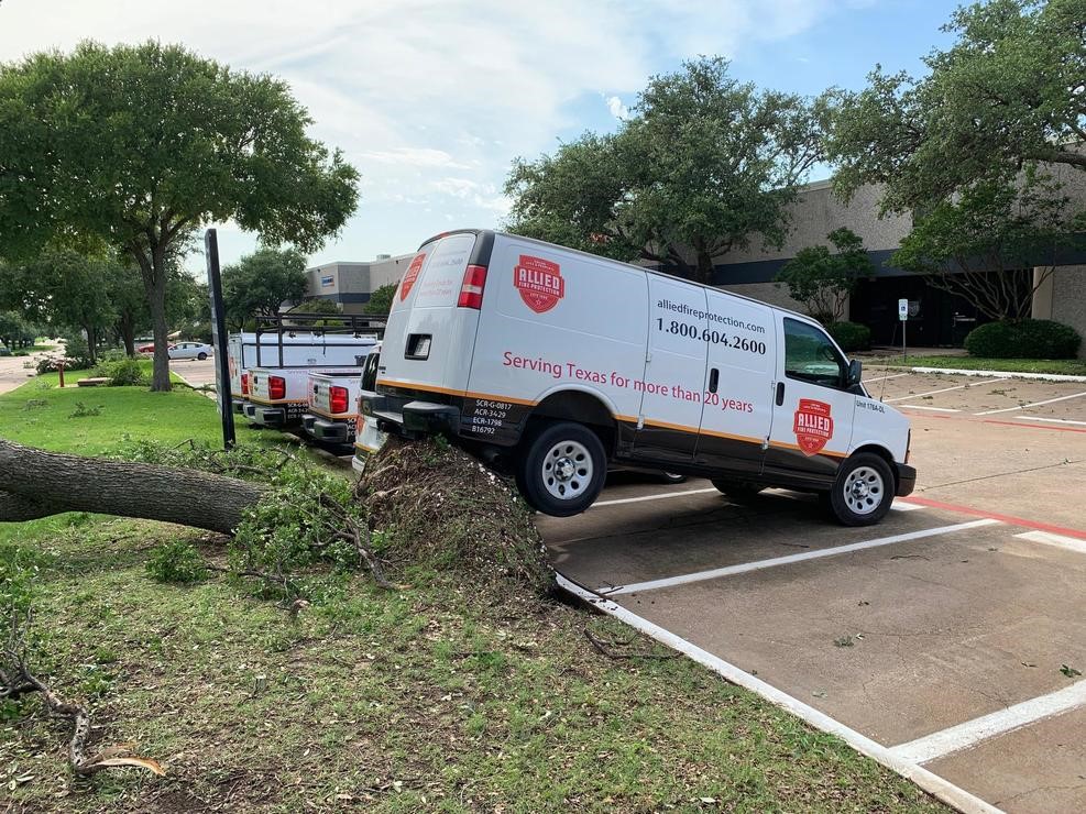 This tree damage lifted a van in Addison. Photo by Franklin Yahoo via NBC