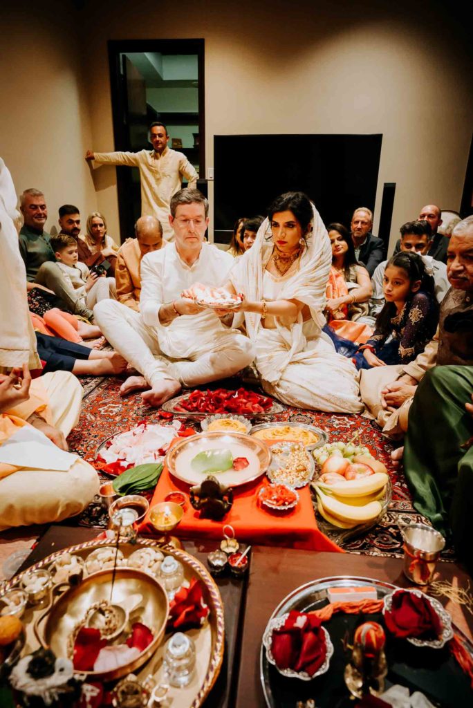 Gary Chapman and Puja Verma are focalpoint of the haldi ceremony which preceded their wedding day. (Photo by Philip Thomas)