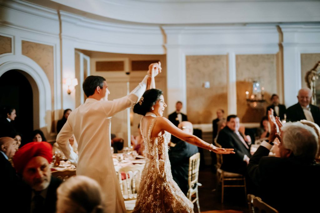The groom sheds his formal black jacket for the spirited dancing in the River Oaks Country Club ballroom. (Photo by Philip Thomas)